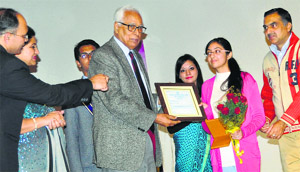 Governor NN Vohra awards a student during the annual day function of Heritage School in Jammu on Wednesday