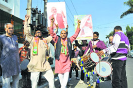 BJP activists dance during the inauguration of the election office for the Gandhi Nagar constituency in Jammu on Wednesday. 