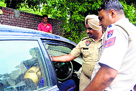 Police officials examine the crime scene.