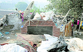 Encroachers have not even spared the foundation stone installed near Buddha Nullah.