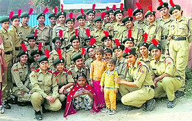 NCC volunteers of the Khalsa College for Women spend time with children at the Missionaries of Charity, Jalandhar Bypass, on Wednesday. 