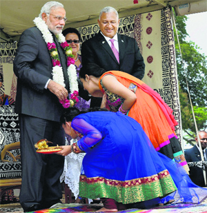 Young girls seek Prime Minister Narendra Modis blessings during a welcome ceremony in Fiji on Wednesday. 