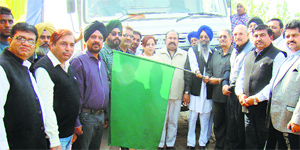 Officials of the Punjab Small Industries Export Corporation at the opening of a state-run sand quarry at Burj Tehal Dass village in Nawanshahr on Wednesday.