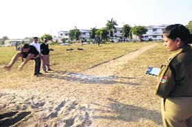 SSP Sweety Aggarwal monitors the physical endurance test for the posts of sub-inspector at Roshanabad in Haridwar on Wednesday