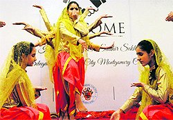 Girls perform a traditional folk dance to welcome a delegation from the US in Amritsar on Thursday