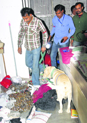 Bomb squad members search Satlok Ashram on Thursday.