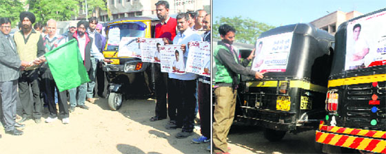Deputy Commissioner AK Sahu flags off the state-level voters awareness campaign through Hindi, English and Urdu posters on auto-rickshaws; and (right) a driver pastes a poster on his vehicle in Jammu on Thursday.