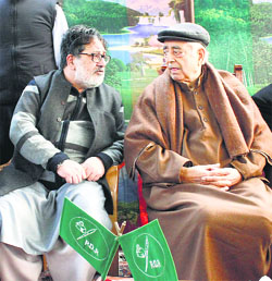 PDP leader Zafar Mehraj with party patron Mufti Mohammad Sayeed during a rally at the latters residence in Srinagar.