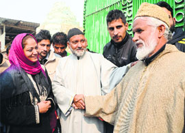 Hina Shafi Bhat, BJP candidate from Amira Kadal, meets people during door-to-door campaigning in the Gangbugh area on the outskirts of Srinagar.