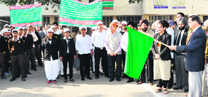 District and Sessions Judge R S Attari flags off an awareness rally on the National Lok Adalat to be held on December 6 in Jalandhar on Thursday. 