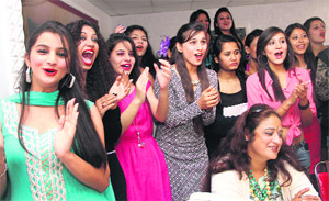 Models cheer for contestents at the Miss Uttarakhand talent hunt in Dehradun on Thursday.