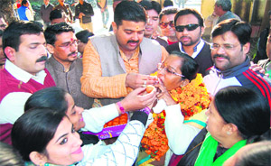 Ward number 22,Gobindpuri BJP candidate Vandana Gupta, who was declared the winner, with party divisional president Vikas Tiwari and secretary Anamika Sharma outside the counting venue in Haridwar on Thursday