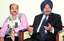 RTS Commissioner Dalbir Singh Verka (right) addresses an officials meeting in Amritsar on Friday