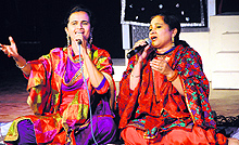 Lachi Bawa and Galori Bawa sing during the folk festival at Virsa Vihar in Amritsar on Friday