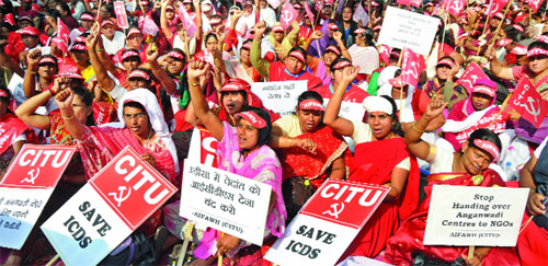 Activists of All India Federation of Anganwadi Workers and Helpers raise slogans during a demonstration near Parliament House against the ongoing privatisation of the Integrated Child Development Services in the name of ICDS Mission, in New Delhi on Friday.