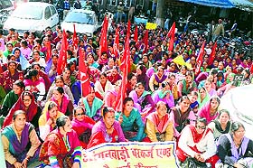 Anganwari workers protest in front of the DC office in Mandi on Friday. 