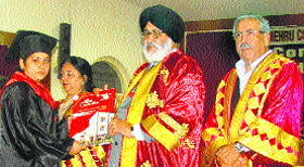 Education Minister Daljit Singh Cheema confers a degree on a student at Kamla Nehru College for Women in Phagwara on Friday.