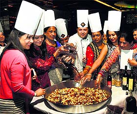 Cake mixing ceremony heralds the Christmas celebrations. 