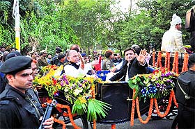 SP chief Mulayam Singh Yadav and his son Akhilesh on a buggy. 
