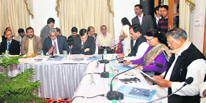 Chief Minister Harish Rawat holds a meeting with NABARD chairman Dr Harsh Kumar Bhanwala in Dehradun on Friday.
