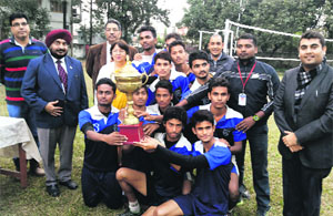 The team of Maa Anandmayee Memorial School, Raiwala, with the winning trophy of the Dehradun District Council Schools Association Senior Boys Volleyball Tournament in Dehradun on Friday.