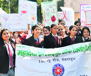 Students of Mahadevi Institute of Technology take out a rally on AIDS and cleanliness in Dehradun on Friday.
