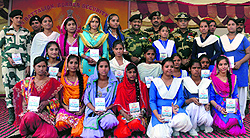 BSF IG Ashok Kumar along with other officials and students of Government Senior Secondary School during the Civic Action Programme at Attari on Saturday