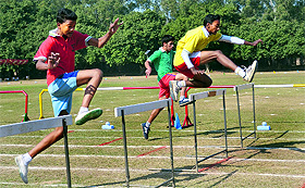 Students take part in a hurdle race at St John's High School in Sector 26, Chandigarh, on Saturday.