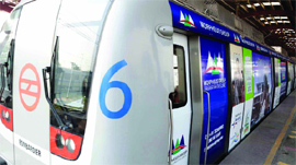 The first Delhi Metro train with advertisements wrapped on its exterior in New Delhi on Saturday.