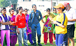 US-based coaches impart training in football to girls at Youth Football Club at Roorka Kalan in Jalandhar on Saturday