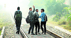 Schoolboys flout rail traffic norms in Jalandhar on Saturday