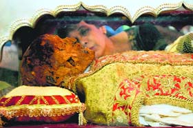 A woman kisses a casket carrying the remains of St Francis Xavier in Goa on Saturday