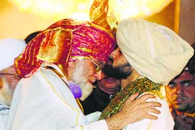 Shaban kisses his father Shahi Imam Syed Ahmed Bukhari at a function in Old Delhi on Saturday