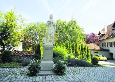 The statue of St Mark in front of St Mary's Minster