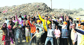 Area residents protest at Bhagtanwala dump yard in Amritsar on Sunday.