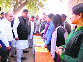 Member of Parliament Raj Kumar Saini (right) during an exhibition at Sanghan village in Kaithal district on Sunday