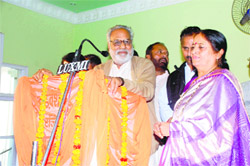 Former minister Ganeshi Lal addresses a function in Fatehabad on Sunday. BJP leader Swatantar Bala Chaudhary looks on