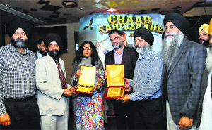 Director Harry Baweja (fourth from left) being honoured by Ranjodh Singh, president, Ramgarhia Educational Council, in Ludhiana