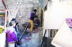 Municipal council team demolish illegally constructed shops in Mussoorie on Saturday