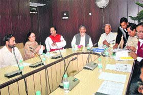 Uttarakhand Speaker Govind Singh Kunjwal along with Chief Minister Harish Rawat at an all-party meeting on the eve of the winter session of the Uttarakhand Assembly in Dehradun on Sunday