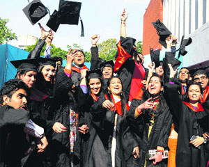 Students celebrate after receiving degrees at Government Medical College in Amritsar on Monday.