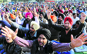 Members of the Master Cadre Union protest in Mohali on Monday. 