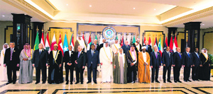 Arab leaders stand for a group photograph before the 25th Arab League summit at Bayan palace in Kuwait City in March 2014.
