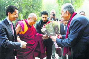 Tibetan spiritual leader Dalai Lama being accorded a warm welcome by Major Vijay Singh Mankotia, vice-president, Himachal Pradesh Tourism Board, at the India International Centre, in New Delhi on Monday