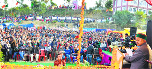 Chief Minister Virbhadra Singh addresses a gathering during Anokhi Dali Mela at Jubbarhatti in Shimla on Monday