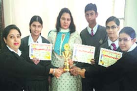 Students of CJS Public School in a jubilant mood after winning the trophy of inter-school quiz competition in Jalandhar
