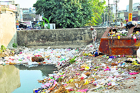 A canal choked with garbage at Nai Basti in Jammu. 