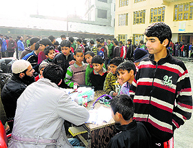 Doctors screen orphans at Rahat Manzil in Srinagar. 