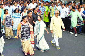 West Bengal Chief Minister and TMC supremo Mamata Banerjee along with party workers participates in a rally at Kolkata on Monday
