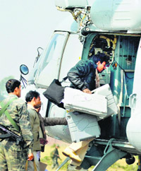 Polling parties board a chopper on the eve of the first phase of the Jharkhand Assembly elections on Monday